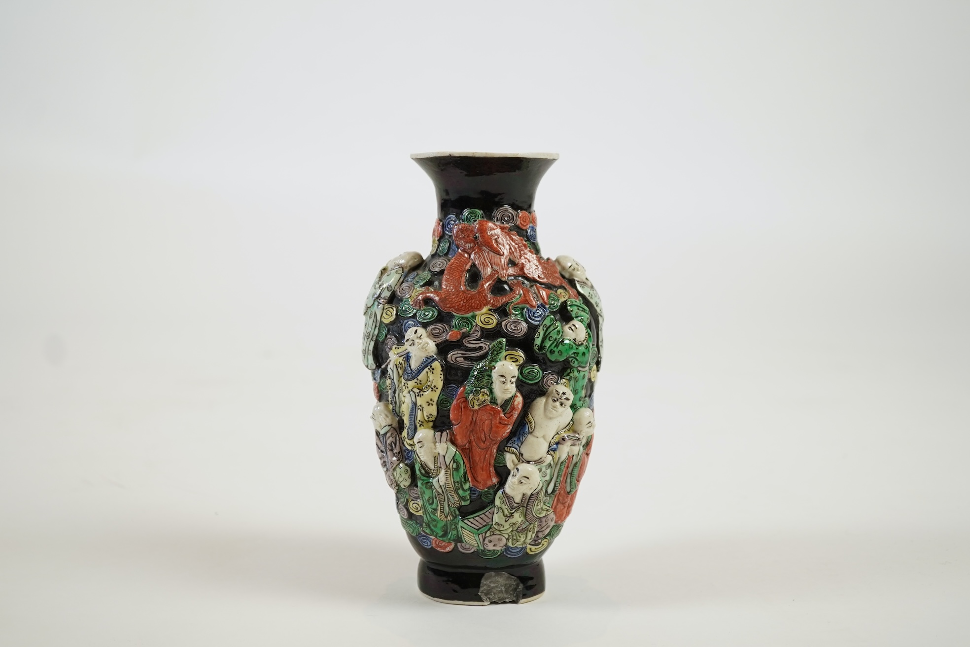 A Chinese enamelled biscuit ‘eighteen Luohan’ vase, 19th century